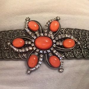 Metal stretch belt with orange stone flower buckle